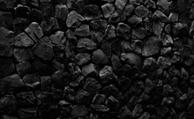 Natural Fire Ashes With Dark Grey Black Coals Texture. It Is A Flammable Black Hard Rock.  Space For Text. 