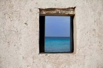 View through a Window of an old Slave Hut on the Caribbean Island of Bonaire