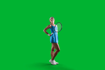 Wall Mural - Girl tennis player on green background.