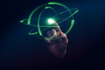 Leinwandbilder - Human forefinger touches green atom. Mixed media.