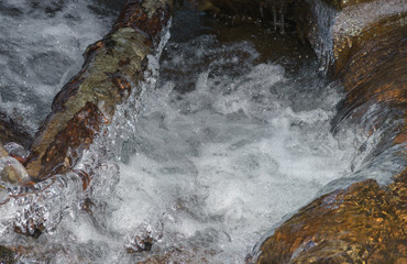 water flowing over rocks close up