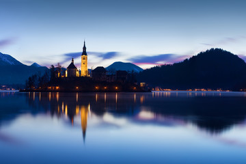Wall Mural - beautiful view of famous bled island (blejski otok) at scenic lake bled with bled castle (blejski gr
