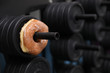 © Ron Alvey - a donut is on a weight rack, a metaphor for a tough life choice