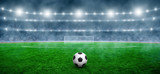 Fototapeta Sport - Soccer ball on stadium with illumination