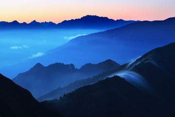 Poster - Panoramic view of idyllic mountain scenery in the Alps with fresh green meadows on a beautiful sunny day in springtime, panoramic view of mountains at border of France and Swiss and Italy