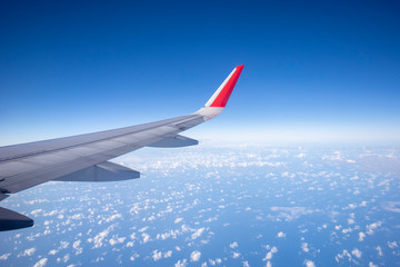 Aeroplane wing view from window beautiful sky. Traveling concept