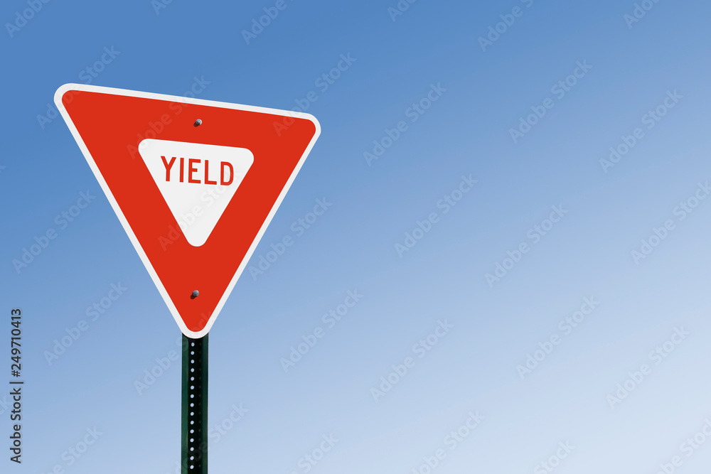 Yield Sign Against Blue Sky - obrazy, fototapety, plakaty 