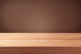 Fototapeta Sawanna - Empty wooden table over brown wall background.