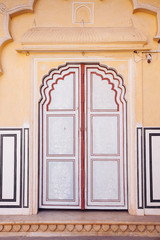 Wall Mural - Old Doors of the Hawa Mahal. Hawa Mahal, the Palace of Winds in Jaipur, Rajasthan, India.