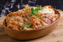 tasty delicious penne rigate pasta in rustic bowl