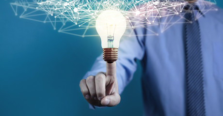 Wall Mural - internet network with creative light bulb. business technology concept