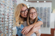 © Yakobchuk Olena - Caring positive mother embracing her smiling daughter
