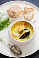 Wall Mural - Scandinavian creamy fish soup with halibut, prawns and mussels