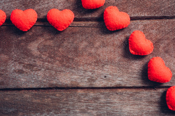 Fabric red heart on wooden background