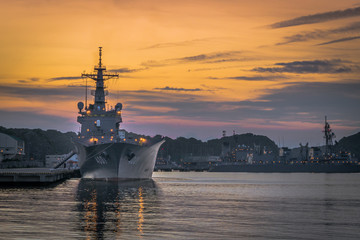 Naval warships at sunset