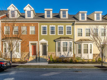 Typical American Town House, Town Home Neighborhood With Colorful Real Estate Houses At A New Construction East Coast Maryland Location With Blue Sky