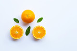 Fototapeta Kuchnia - High vitamin C. Fresh orange citrus fruit with leaves isolated on white