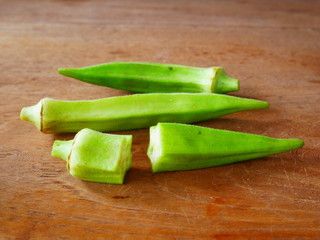 fresh okra on wood background,organic vegetable food