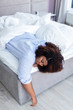 © alfa27 - tired african american woman sleeping in bed at home. close up photo. rest time. free time, spare time