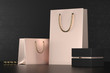 Premium shopping bags mock-up, package for purchases on a black background. Rose gold paper shopping bag with golden handles Mock Up. Luxury bag and black box, 3d rendering.