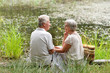 © aletia2011 - Portrait of nice mature couple sitting by pond