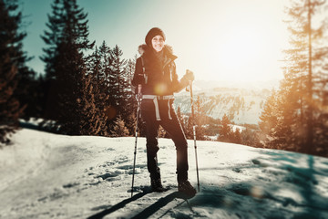 Wall Mural - Woman snow hiking in winter