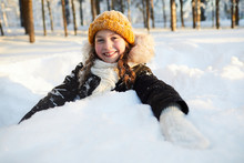 Portrait Of Happy Little Girl Playing In Snow In Beautiful Winter Forest, Copy Space
