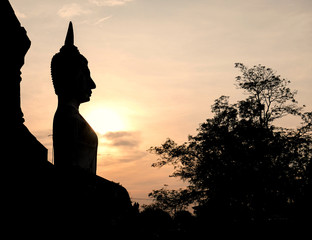 Wall Mural - Black buddha silhouette with two tone sky