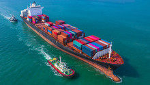 Container Ship Arriving In Port, Tug Boat And Container Ship Going To Deep Sea Port, Logistic Business Import Export Shipping And Transportation, Aerial View.