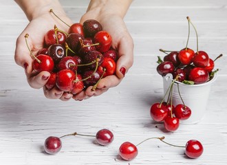 Healthy fruit, strawberry, blueberry, sweet cherry on wooden whi