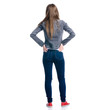 © Kabardins photo - Woman in jeans standing on white background. Isolation, back view