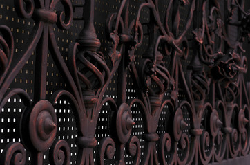 Wall Mural - Decorative processing of metal forged gates in dark colors