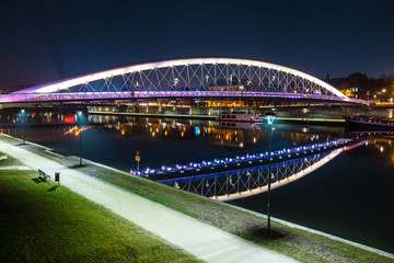 Bernatka footbridge over Vistula river at night, Krakow, Poland