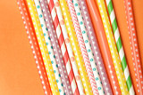 Fototapeta Tęcza - Colorful single-use plastic straws, studio shot
