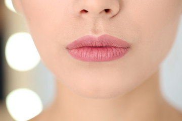 Sticker - Young woman wearing beautiful lipstick on blurred background, closeup