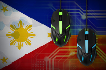 Philippines flag  and two mice with backlight. Online cooperative games. Cyber sport team