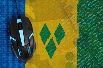 Saint Vincent and the Grenadines flag  and computer mouse. Digital threat, illegal actions on the Internet