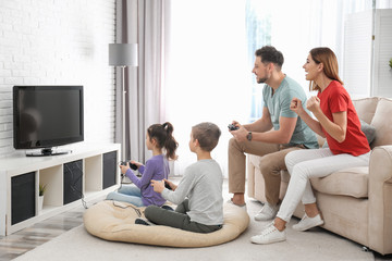 Sticker - Happy family playing video games in living room