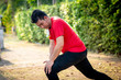 © nuiiko - Happy Asian sport man doning exercise in the park outdoor.