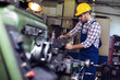 © zorandim75 - Turner worker is working on a lathe machine in a factory