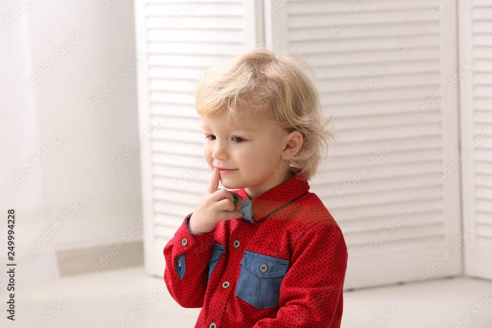 Portrait of cute little boy at home