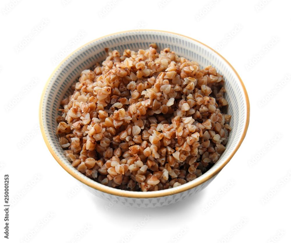 Bowl with tasty boiled buckwheat on white background