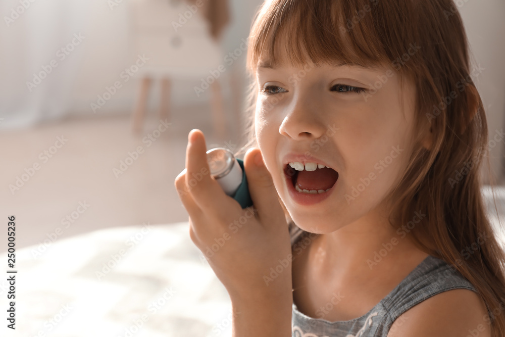Little girl with inhaler having asthma attack at home