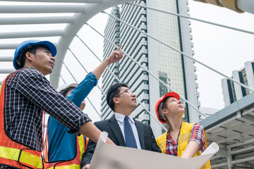 Businessman meeting with engineer team talking progression report project construction