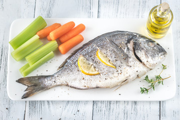 Wall Mural - Baked dorada with fresh vegetables