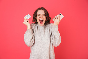 Wall Mural - Portrait of a cheerful young woman standing