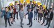 © saksit - Dealing and success team asian people shaking hand and Raise hand to celebrate in office.