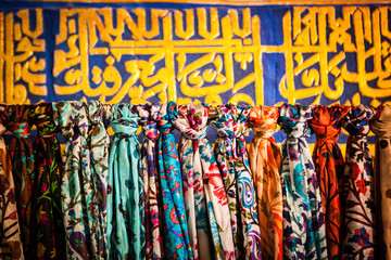 Display of colourful silk national scarves