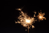 Fototapeta Sypialnia - Sparkler at Christmas time and new year’s eve