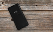 © Denis Rozhnovsky - Smartphone on a wooden background.
